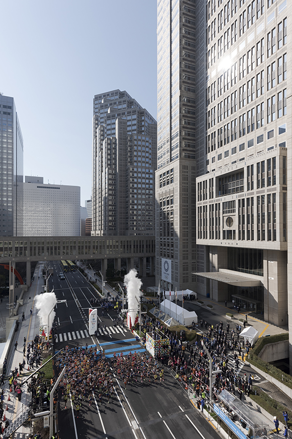 Image of marathon runners outside the TMG buildings