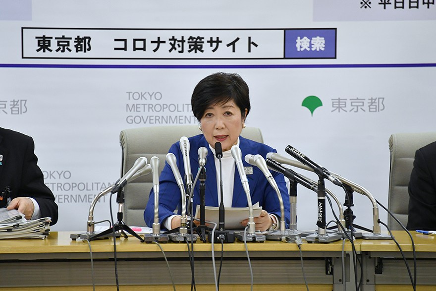 Image of Governor Koike holding a press conference