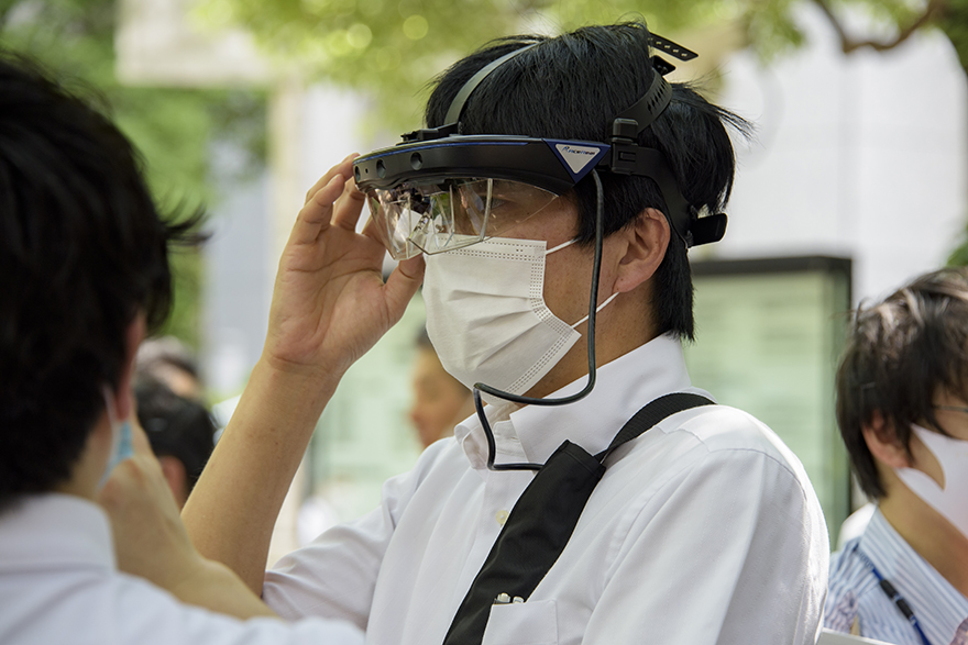Image of a man experiencing AR using smart glasses