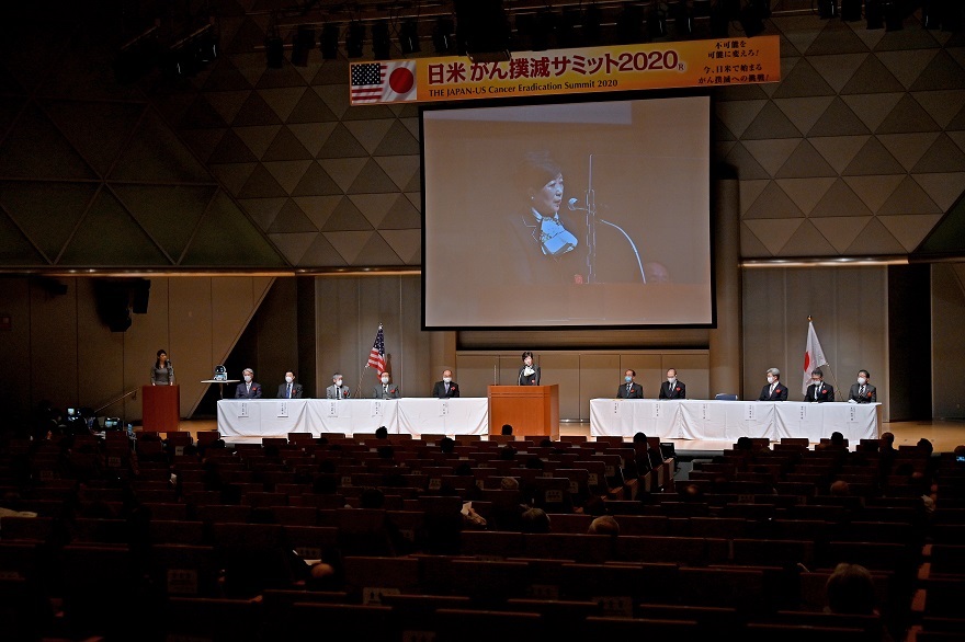 Governor Koike giving a speech at the summit
