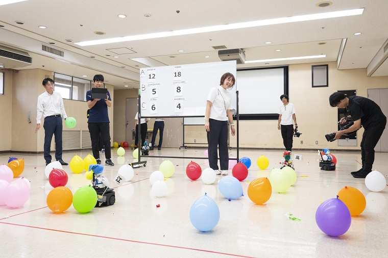 Photo 2: Avatar robots competing in balloon popping