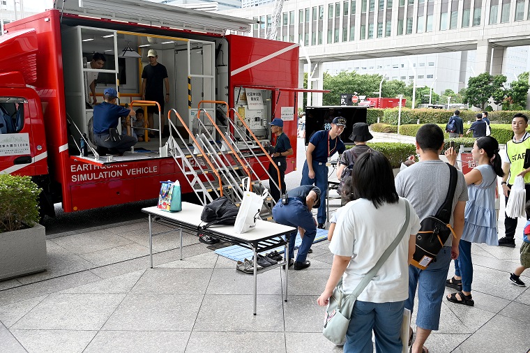 Photo: Participants experiencing an earthquake simulation vehicle