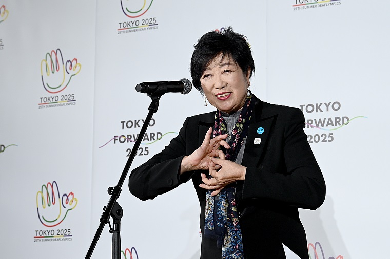 Photo: Governor Koike greeting the audience in her role as organizer